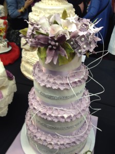 Cake International purple ruffle wedding cake