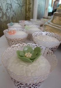Green wedding cake and cupcakes