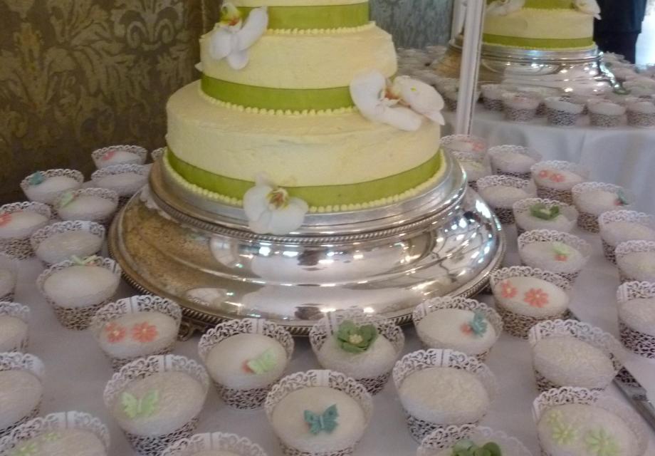 Green wedding cake and cupcakes