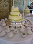 Green wedding cake and cupcakes